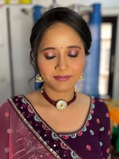 A close-up of the eye makeup, showing the beautiful blend of shimmery pink and purple eyeshadows.