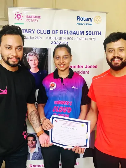 Parnavi H A with her coaches after her semifinalist performance in the U15 category at the Belagavi tournament.