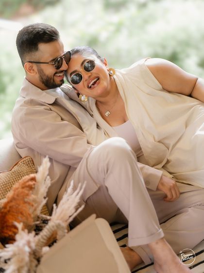 Part fun, part magic, and all heart. This candid shot from a relaxed indoor session in Alibaug captures the couple's playful and affectionate dynamic, proving that the best photos happen when you're just being yourselves.