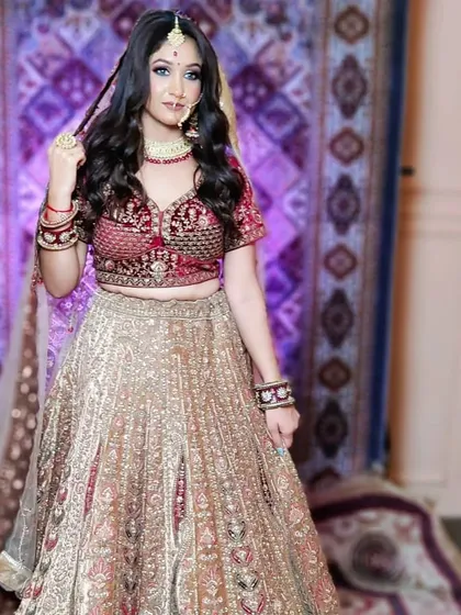 A full view of the Marwari-style lehenga, showing the contrast between the red blouse and the gold skirt. The entire look is available for rent at my Delhi studio.