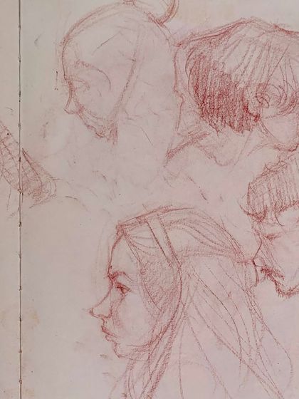 A page of delicate, classical-style portrait sketches in red pencil, capturing the faces of the festival.