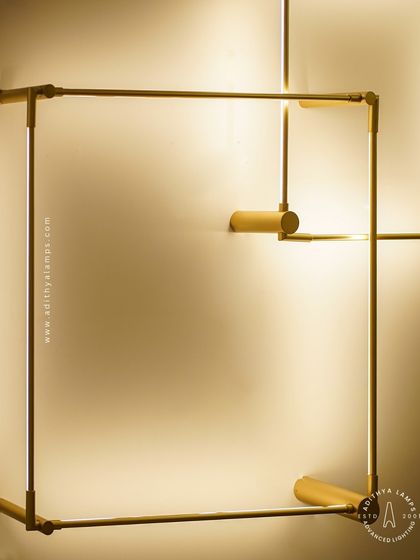 A closer look at our minimalist square LED wall sconces. The slim gold-finished frame emits a soft backlight, creating a halo effect on the wall. These can be arranged in overlapping patterns for a custom art installation.