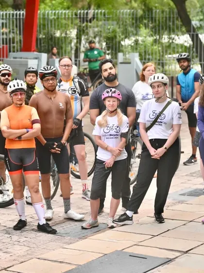 Members of our group and the Polish embassy listening to a briefing before the "Cycle for a Better World" ride.