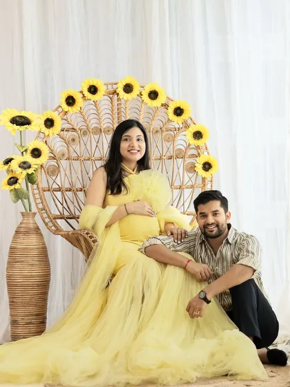 Your pregnancy photoshoot should be a reflection of your joy. We loved creating this bright and cheerful sunflower-themed setup for this happy couple in our studio.