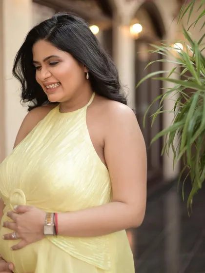 This shot captures the joy and anticipation of motherhood. The makeup is designed to be light and comfortable, enhancing her natural beauty without feeling heavy.