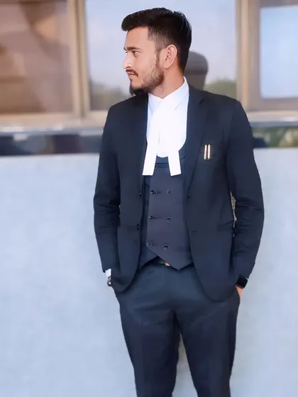 A professional portrait in a three-piece suit and advocate's band. This is the uniform of my profession, and I wear it with pride.
