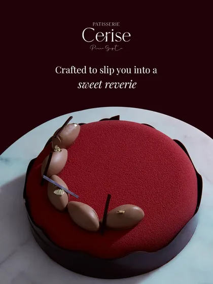 This is my Choco Framboise, finished with a deep red velvet spray. The finish is not just for appearance; it seals the delicate layers inside, preserving the textures of the dark chocolate mousse and sharp raspberry crémeux until you are ready to indulge.