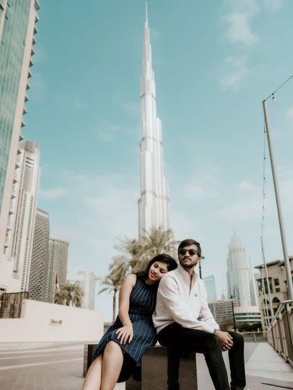 A sweet moment with the Burj Khalifa in the background, capturing the couple's affection.