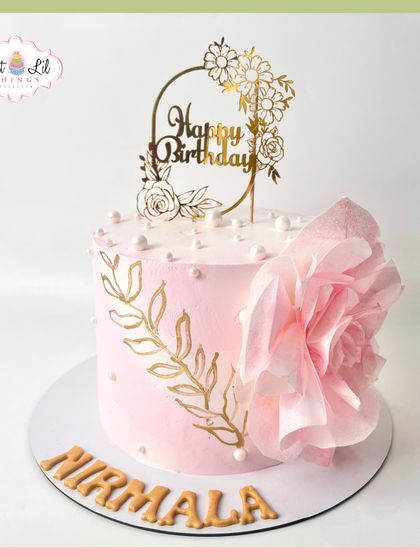 A pretty-in-pink pastel cake for Nirmala's birthday. This elegant design is decorated with a hand-painted gold leaf pattern and a large, delicate wafer paper flower.