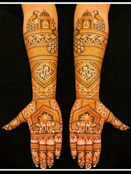 A classic and symmetrical design featuring elephants and lotus motifs on the palms, with traditional patterns on the arms.