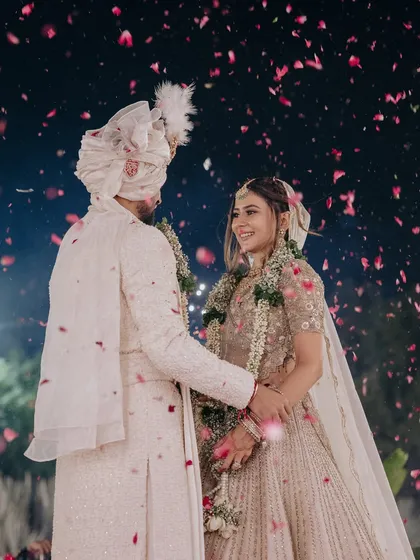 A picture-perfect moment from the wedding day. My goal is to create a timeless bridal look that feels light, looks flawless in photos, and lasts through every emotional and happy moment, like this beautiful petal shower.