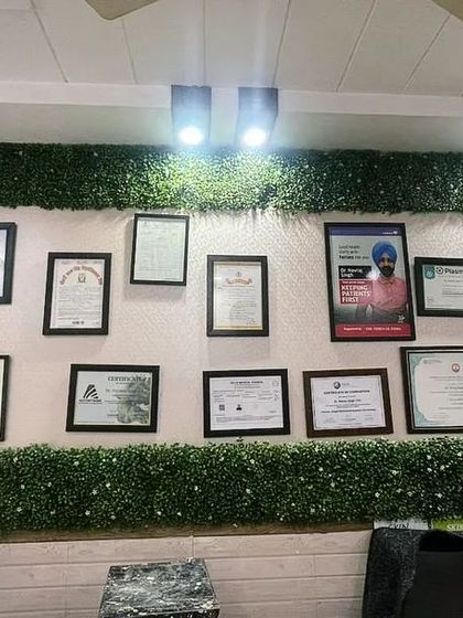 For this skin and dental clinic, we designed an artificial green border to frame their wall of certificates. This adds a professional yet calming touch of nature to the reception area.