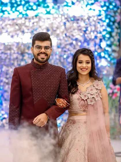 The grand entrance at the sangeet. The smoke effect and their confident smiles set the tone for a night of celebration.