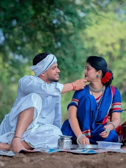 A tender moment captured during the picnic scene of the Shetkari shoot. His gentle touch and her calm expression make for a deeply romantic photograph.