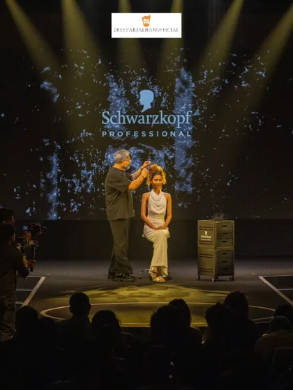 On stage for Schwarzkopf Professional, demonstrating an intricate updo in front of a live audience. These moments are about sharing the craft and passion behind creating trend-setting hairstyles.