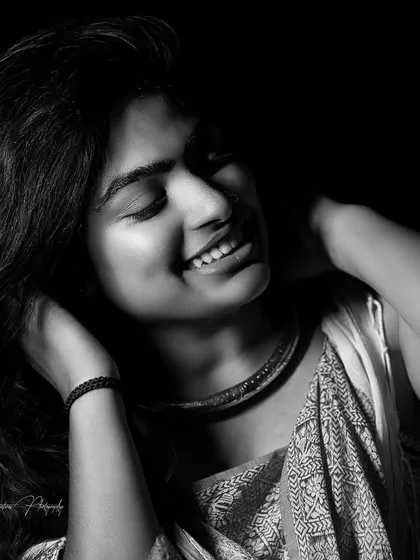 A duplicate of the black and white portrait, showing the power of a good smile and great makeup.