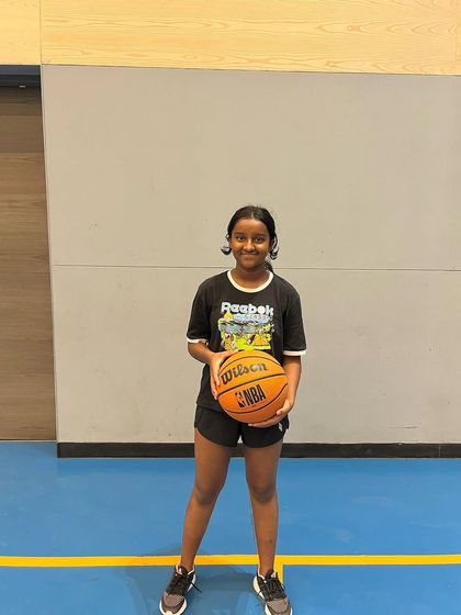 A happy camper from our summer basketball program. We focus on making fitness and skill-building an enjoyable experience.