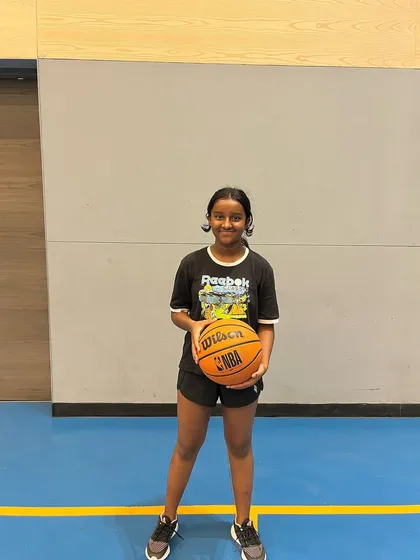 A happy camper from our summer basketball program. We focus on making fitness and skill-building an enjoyable experience.