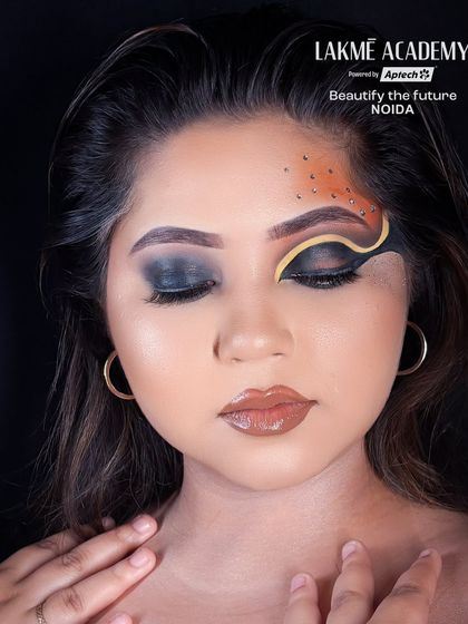 The Brazilian eye makeup trend is perfect for a bold party look. This image shows a dramatic, graphic design with a smokey blend.