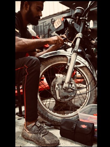 Just a man and his best friend, a set of Knipex tools, working on a vintage bike.