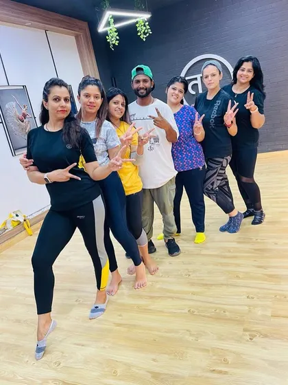 Posing for a group picture after a great session. This is our fitness family, always motivating each other to do our best.