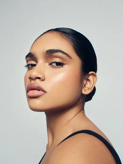 Serving major makeup goals with this clean beauty look. The focus is on a radiant, 'lit-from-within' glow, achieved with strategic highlighting and a perfectly matched base.