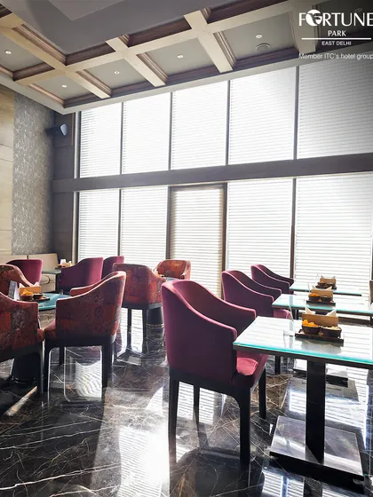 The lounge area of Neptune, with its mix of luxurious fabrics and textures, offers a comfortable and stylish place to relax.