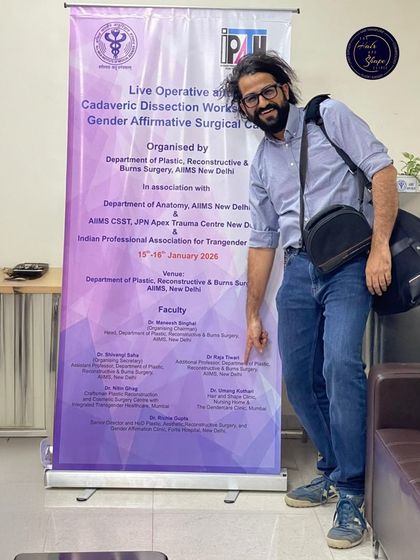 Standing by the faculty banner at the AIIMS workshop on Gender Affirmative Surgical Care. It is a privilege to be listed among such esteemed colleagues and contribute to this important field.