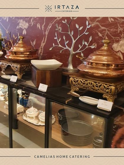 A sophisticated home catering setup at the Camellias, featuring our classic copper serveware that complements the elegant interior decor.