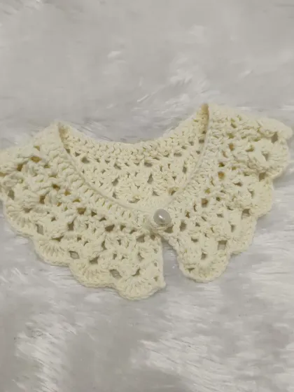A closer look at the beautiful stitch work on this custom-ordered off-white crochet collar.