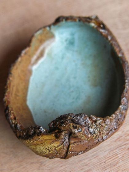 A textured, organic bowl created in a workshop where I explored new techniques like slamming clay for creases and using found objects for impressions.