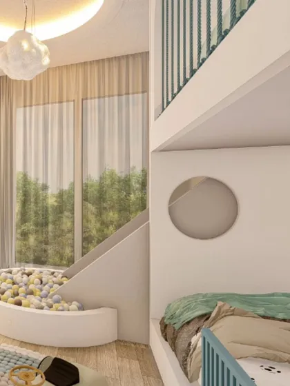 This shot highlights the slide and ball pit area, showing how it connects to the loft bed. The large window allows for plenty of natural light, making the play area feel bright and inviting.