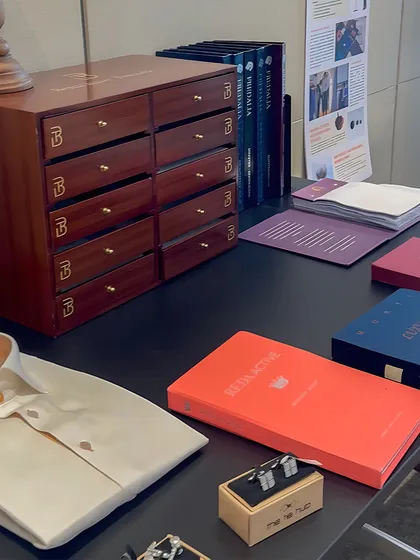 A display of fabric books and accessories at our Khaitan trunk show. We provide a comprehensive selection to ensure every client can build a wardrobe that is uniquely their own.