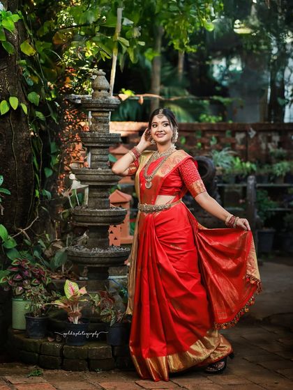 A behind-the-scenes and final look from a makeup artist's portfolio shoot. The model is in a classic red bridal saree, showcasing the transformation and the beautiful final result.