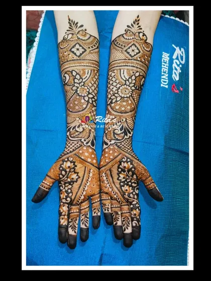 The completed engagement design, featuring a mix of floral, peacock, and geometric patterns for a full and elegant look.