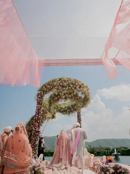 For this destination wedding in Udaipur, we created a breathtaking ceremony with a floating floral mandap. The infinity floral arch against the sky made for a truly unforgettable Anand Karaj ceremony.