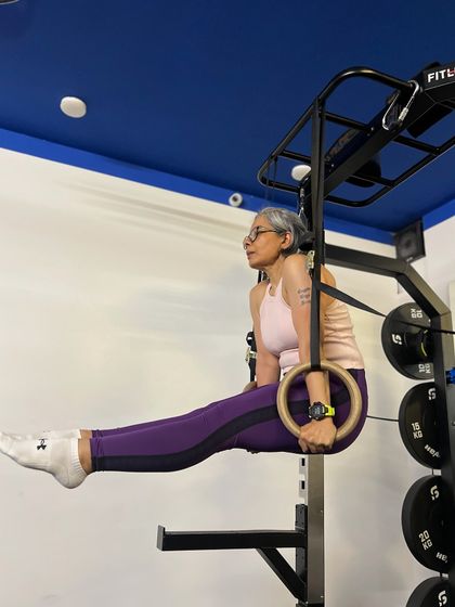 This client demonstrates incredible strength and control, holding a perfect L-sit on the gymnastic rings. It's an inspiring display of what's possible with consistent training.