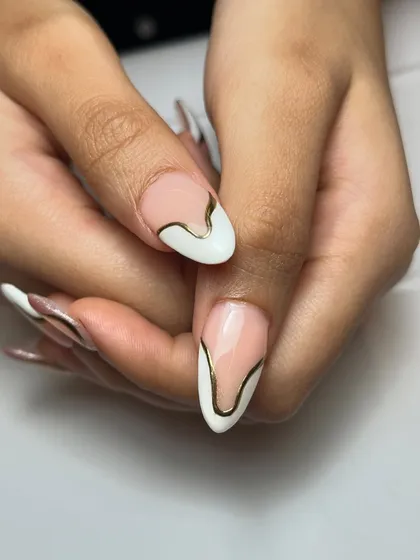 A different perspective on the dramatic curved chrome French design, showing how the lines flow differently on each nail for an abstract, cohesive look.