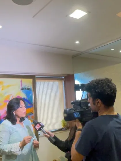 In my office, giving an interview about a recent Bombay High Court decision. It's important to analyze and share insights on such rulings.