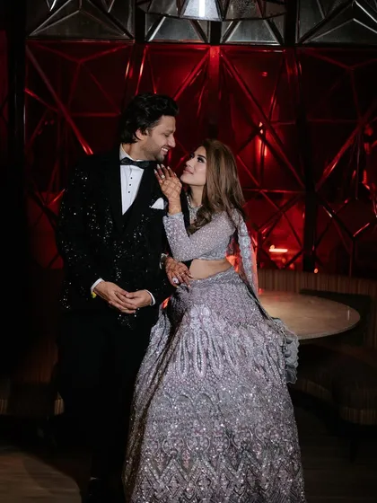 A look of love. This intimate portrait captures the couple's connection during their glamorous Sangeet night.