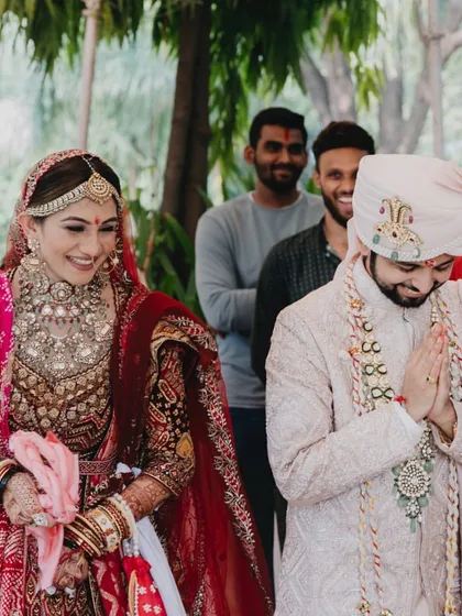 The couple looking serene and happy as they participate in the wedding pooja.