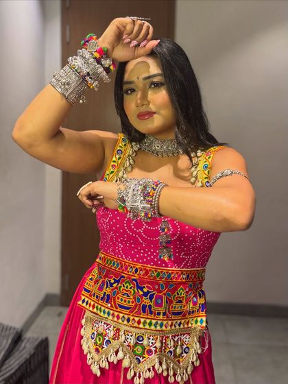 Striking a pose in my Navratri attire. The layers of oxidized bangles and armlets are an essential part of any traditional Garba look.