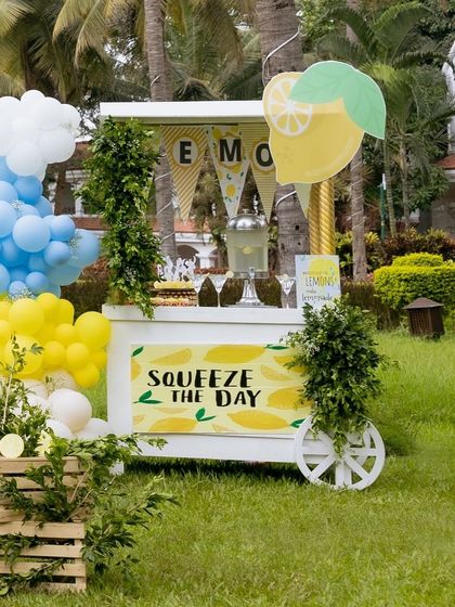 Another view of the charming lemonade cart, a perfect functional and decorative piece for the party.
