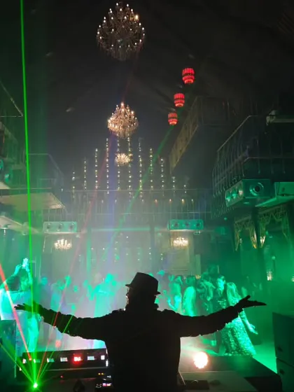 It's all about creating an immersive atmosphere. Here, I'm using a combination of lasers, moving head lights, and chandeliers to transform a club into a high-energy dance zone for a private event. This is how I build the vibe.