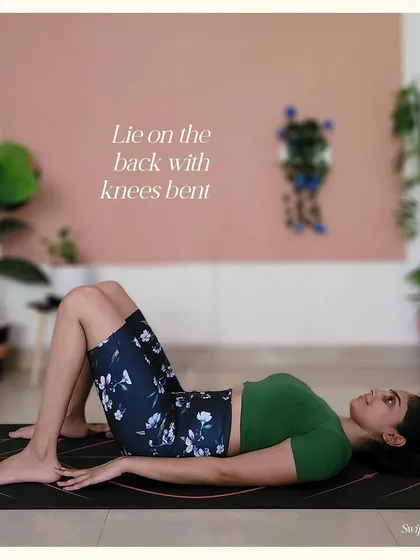 The first step to upward bow pose is lying on your back with knees bent. This initial setup is crucial for the steps that follow.