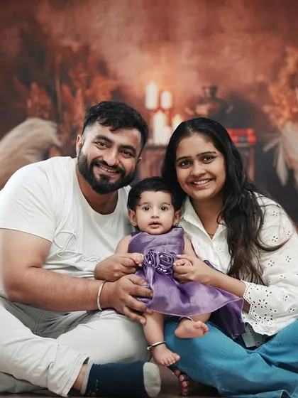 The complete family joins in for a portrait to celebrate their daughter being six months old.