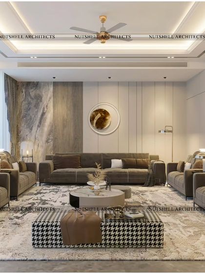 The seating arrangement in the drawing room is designed for conversation, with multiple sofas and a distinctive houndstooth ottoman. The use of a large area rug helps to define the lounge space within the open-plan room.