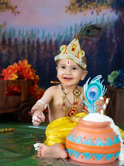 A happy little Krishna after getting a taste of his birthday cake. This is a wonderful and unique way to celebrate a first birthday.