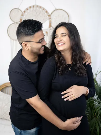 A candid moment from a lifestyle maternity shoot. The genuine laughter between this couple shows the comfortable and relaxed atmosphere I create, resulting in natural and joyful couple portraits.