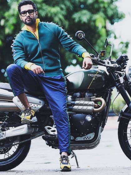 This edgy, sporty look on Vicky Kaushal, featuring a spiked green and yellow jacket, was for a magazine shoot. It shows how versatile styling can be, moving from classic to contemporary with ease.